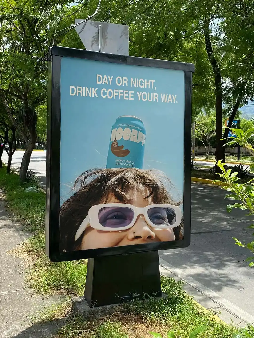 Nocaff poster with can on head - outdoor campaign