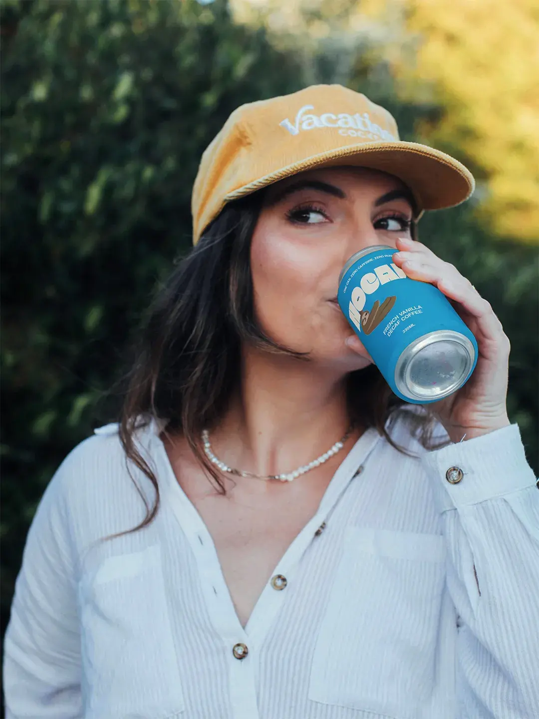 Person drinking Nocaff can